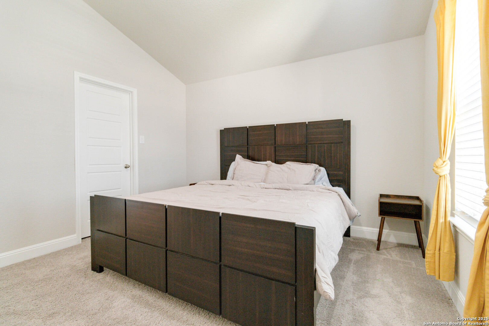 2210 Castello Way San Antonio, TX 78259 - Photo 29 of 48 a bed sitting in a bedroom next to a window