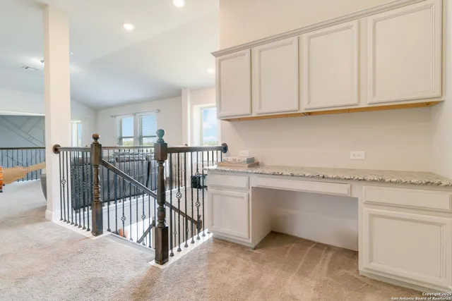 a kitchen with white cabinets