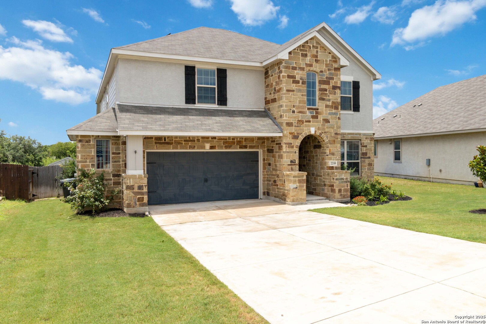 2210 Castello Way San Antonio, TX 78259 - Photo 3 of 48 a front view of a house with a garden and yard