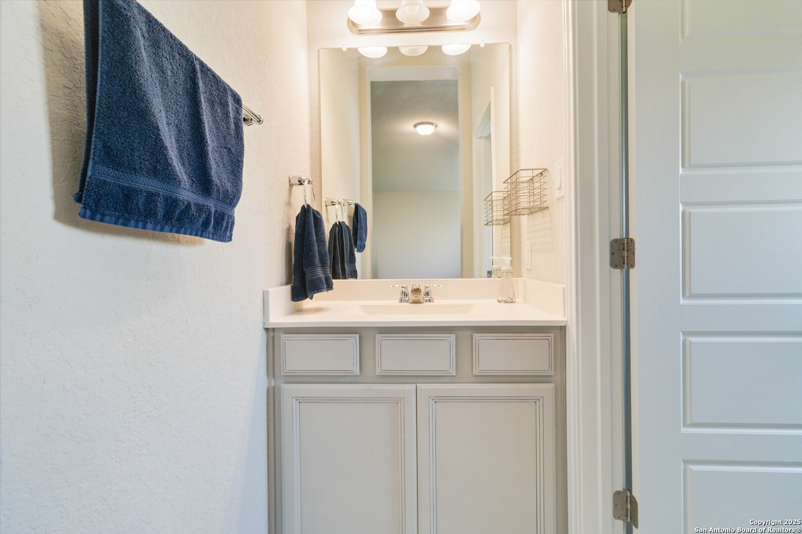 2210 Castello Way San Antonio, TX 78259 - Photo 36 of 48 a bathroom with a sink and a mirror