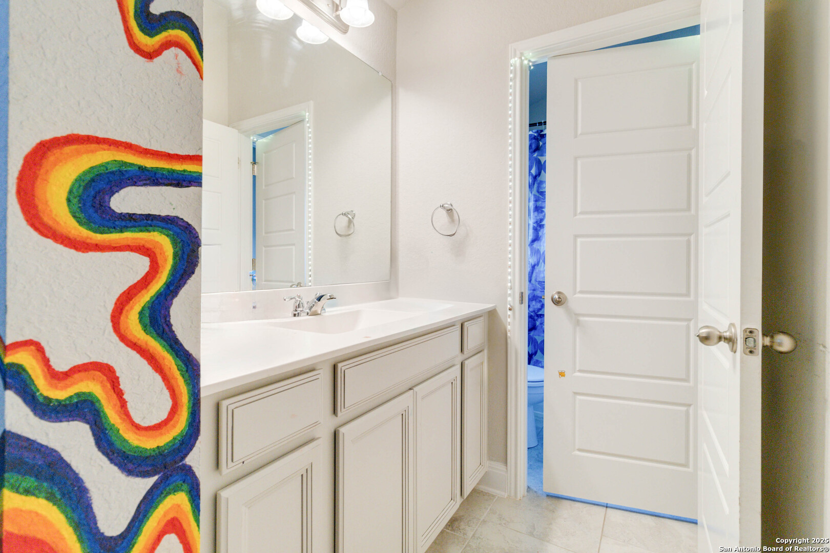 2210 Castello Way San Antonio, TX 78259 - Photo 37 of 48 a bathroom with a sink a mirror and a shower