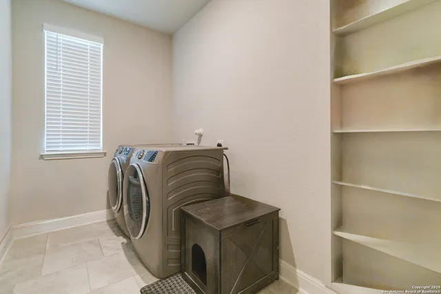 a utility room with washer and dryer