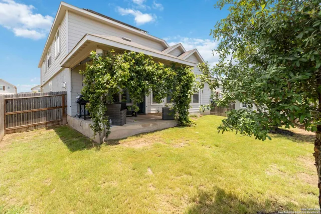 a swimming pool with yard in front of it