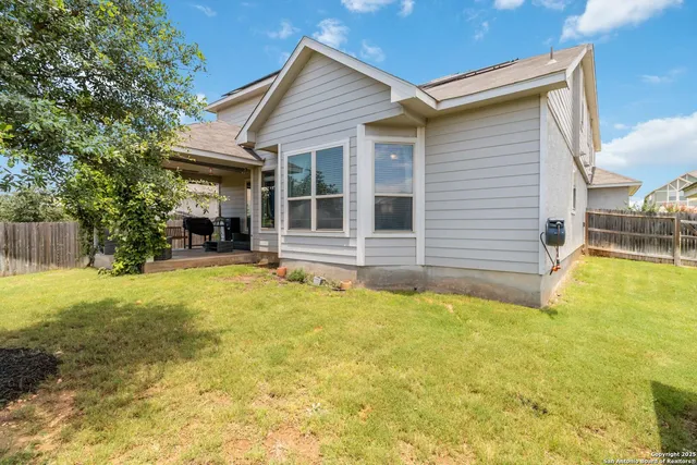 a house view with swimming pool in front of it