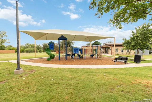 a view of a swimming pool with lawn chairs