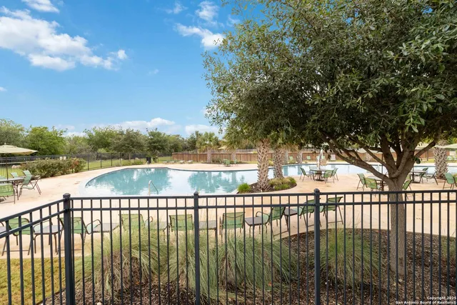 a view of swimming pool from a balcony