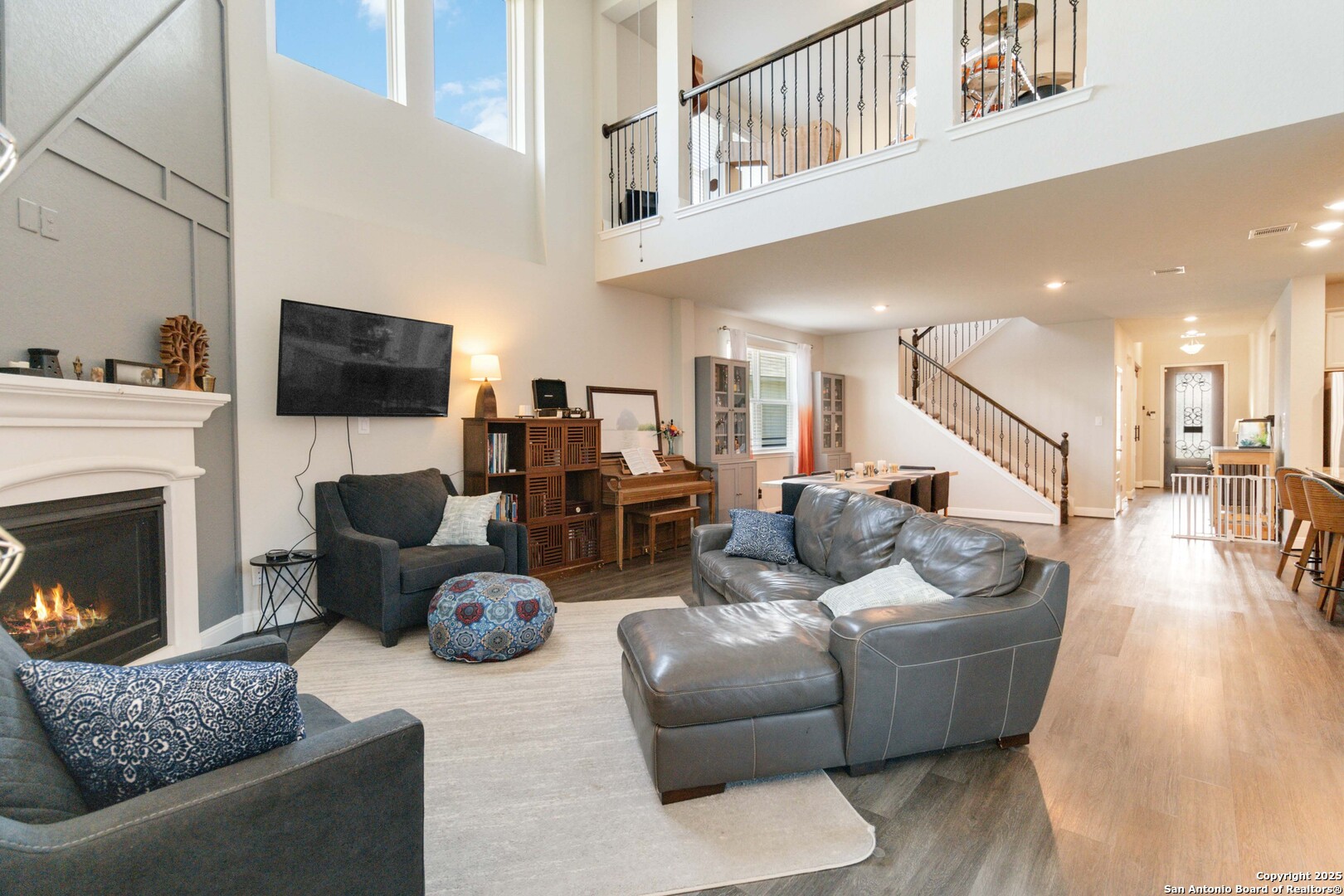 2210 Castello Way San Antonio, TX 78259 - Photo 7 of 48 a living room with furniture a fireplace and a flat screen tv