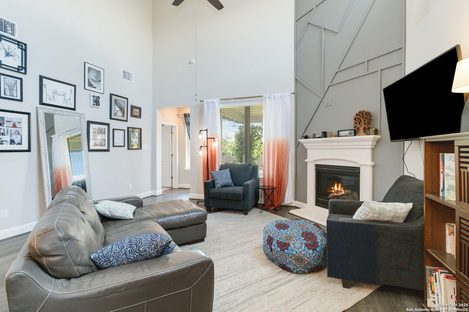 2210 Castello Way San Antonio, TX 78259 - Photo 9 of 48 a living room with furniture a flat screen tv and a fireplace