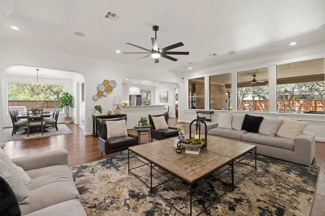 a living room with furniture and a large window