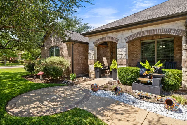 a view of a house with outdoor seating space