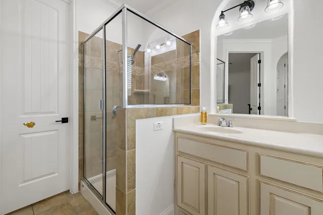 a bathroom with a double vanity sink mirror and double