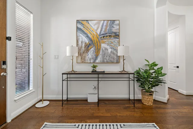 a living room with a potted plant