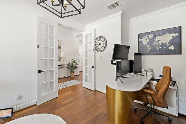 a workspace with furniture and wooden floor