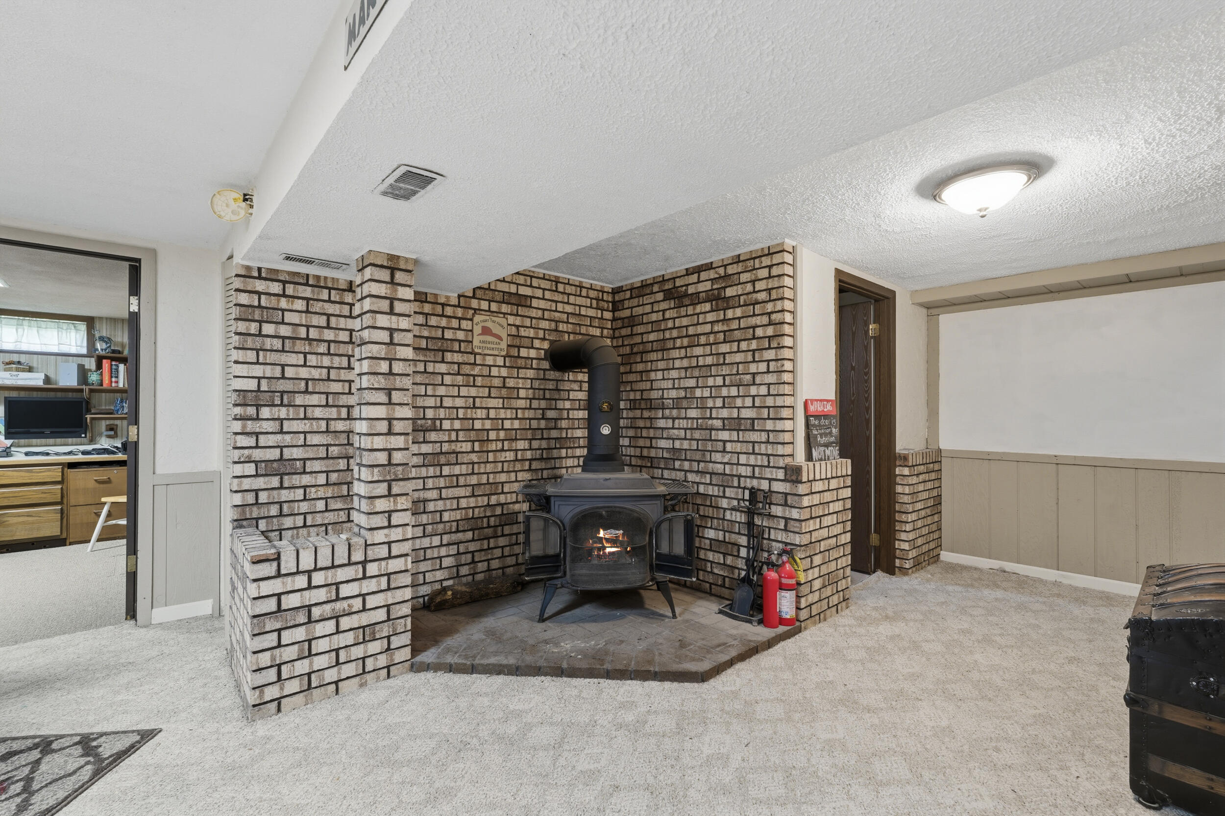 5430 Cook Road Swartz Creek, MI 48473 - Photo 25 of 39 Cook Rd Basement Wood Burner