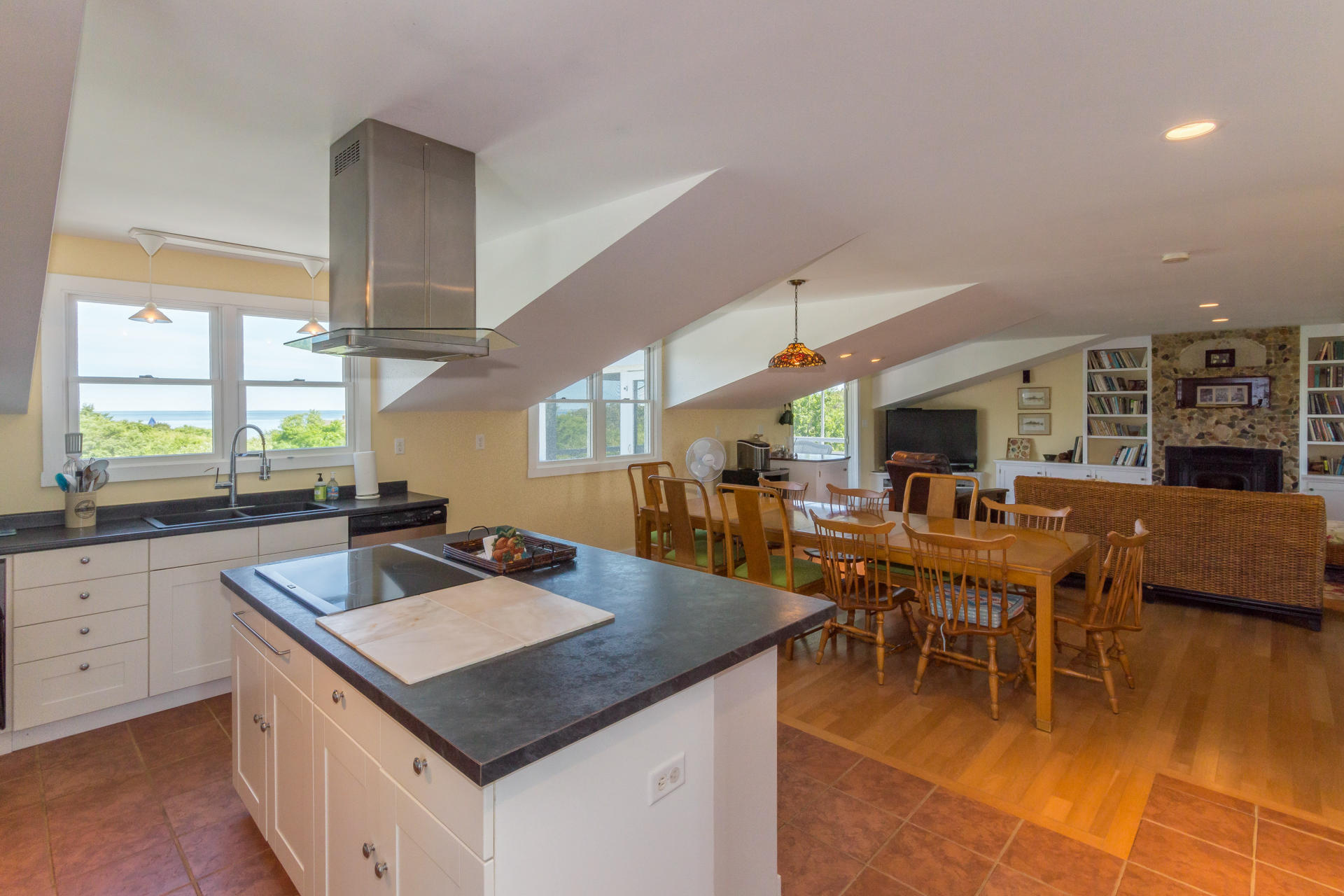 10 Calebs Pond Road Edgartown, MA 02539 - Photo 3 of 26 a kitchen with a sink counter and chairs
