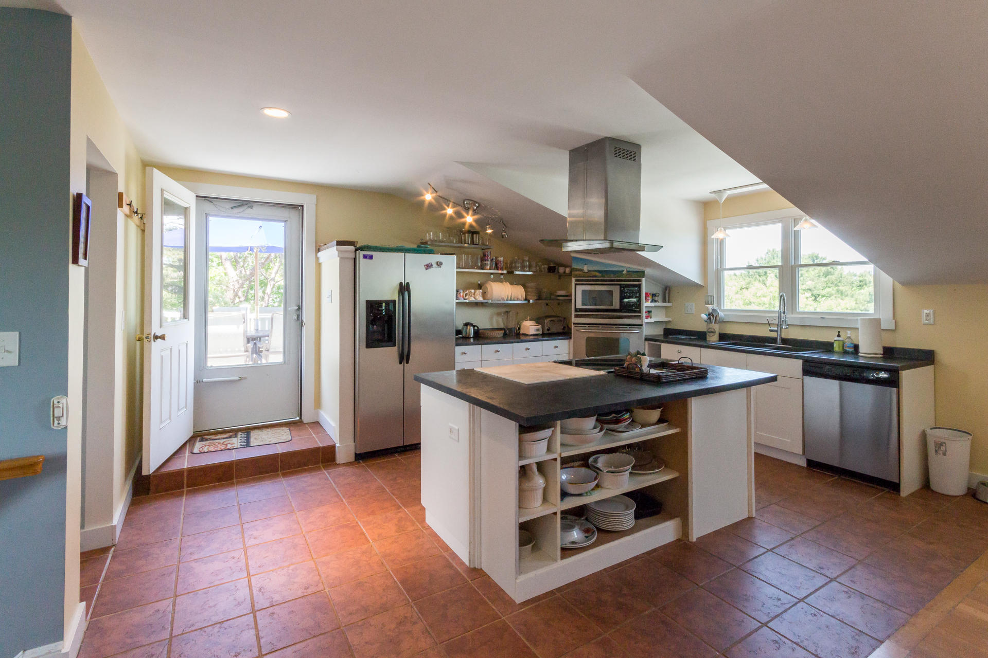 10 Calebs Pond Road Edgartown, MA 02539 - Photo 8 of 26 a kitchen with stainless steel appliances granite countertop a stove a refrigerator and a sink