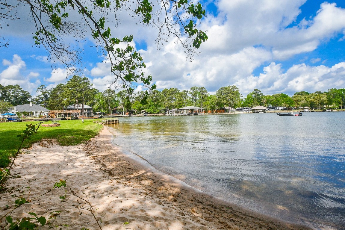 500 River Road, Unit 101 Montgomery, TX 77356 - Photo 24 of 27 Sandy beach area off of green space to wade into water or dip your toes