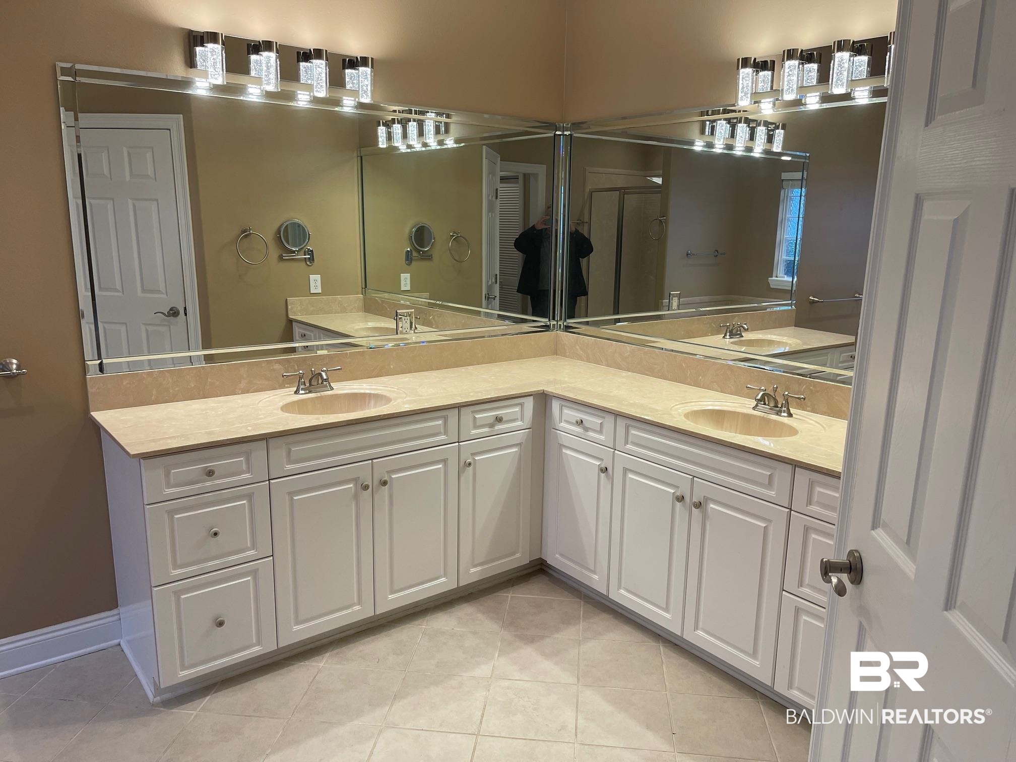 109 Savannah Circle Foley, AL 36535 - Photo 13 of 17 Bathroom with tile patterned flooring, vanity, and walk in shower