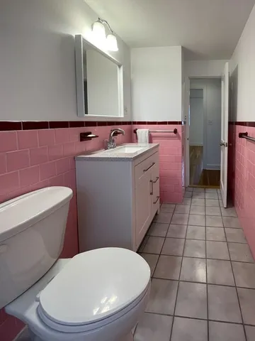 a bathroom with a sink a toilet and bathtub