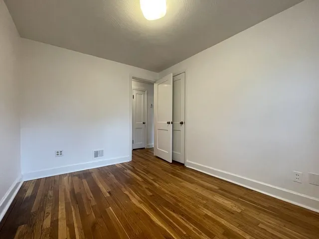 a view of room with wooden floor