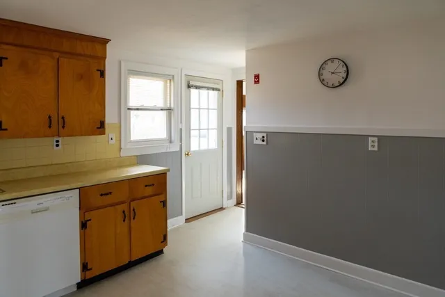 a view of storage and utility room with window