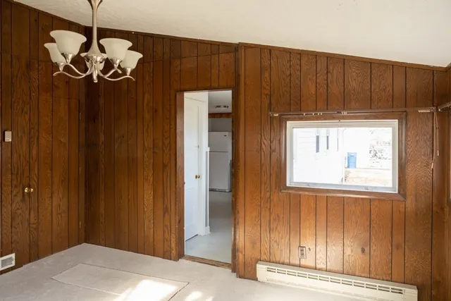 an entryway with wooden floor