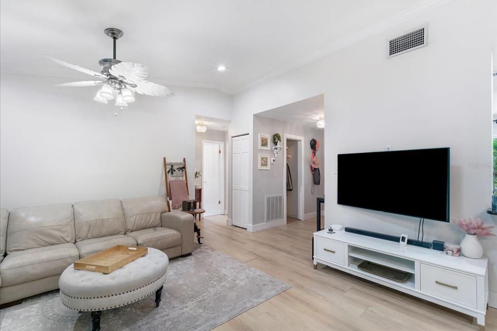 15911 Ironware Place Tampa, FL 33624 - Photo 11 of 31 a living room with furniture and a flat screen tv