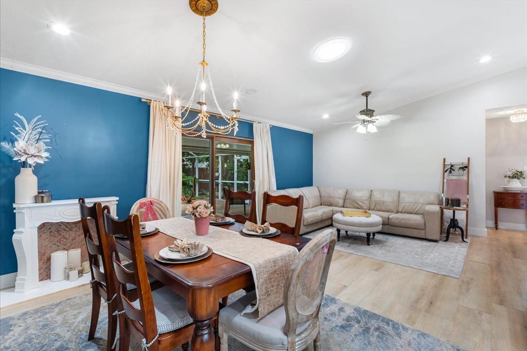 15911 Ironware Place Tampa, FL 33624 - Photo 12 of 31 a dining room with furniture a chandelier and window