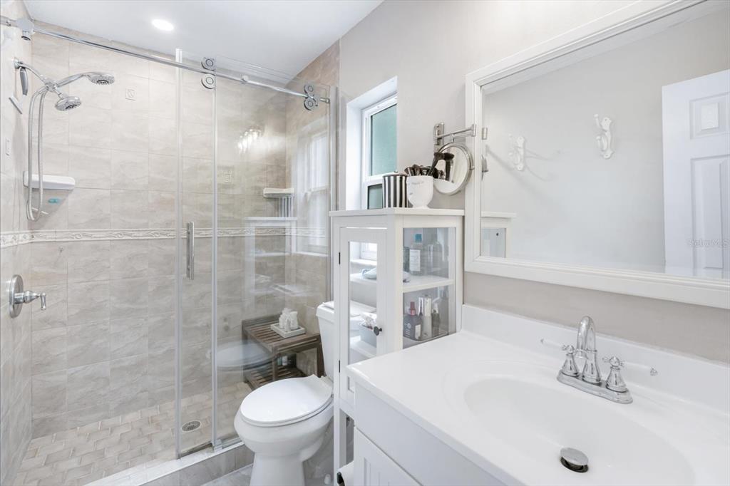 15911 Ironware Place Tampa, FL 33624 - Photo 18 of 31 a bathroom with a sink toilet and shower