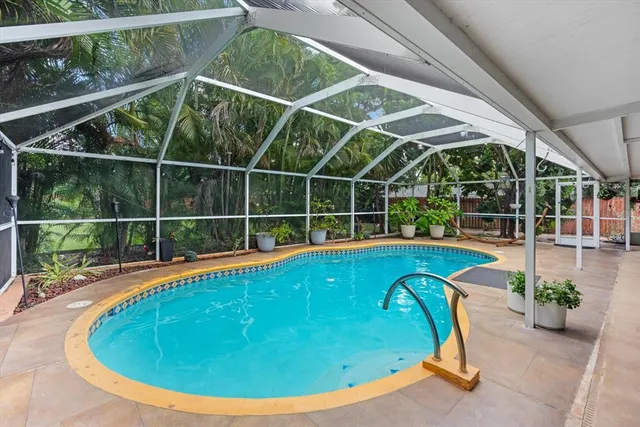 a view of a swimming pool with a garden