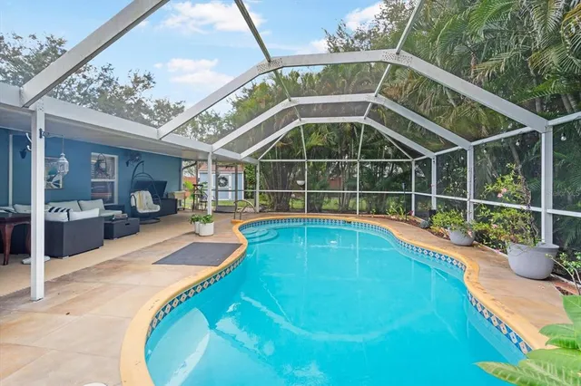 a view of a backyard with a swimming pool