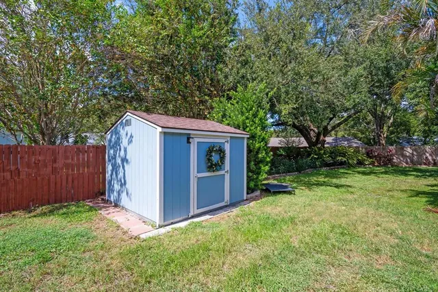 a view of an house with backyard space and garden