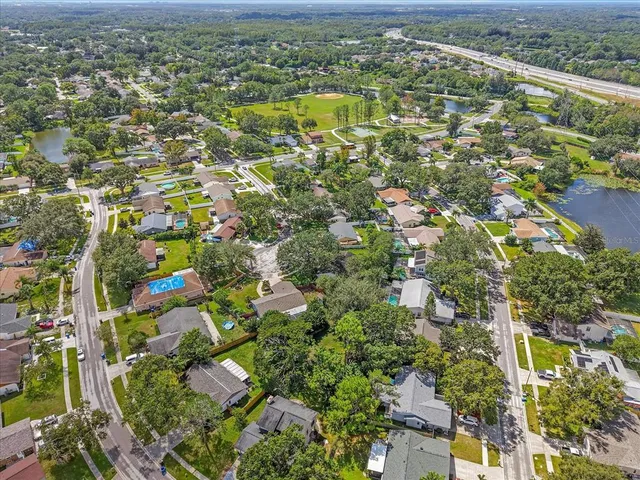an aerial view of residential houses with outdoor space