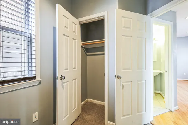 a view of a bathroom with a door and a window