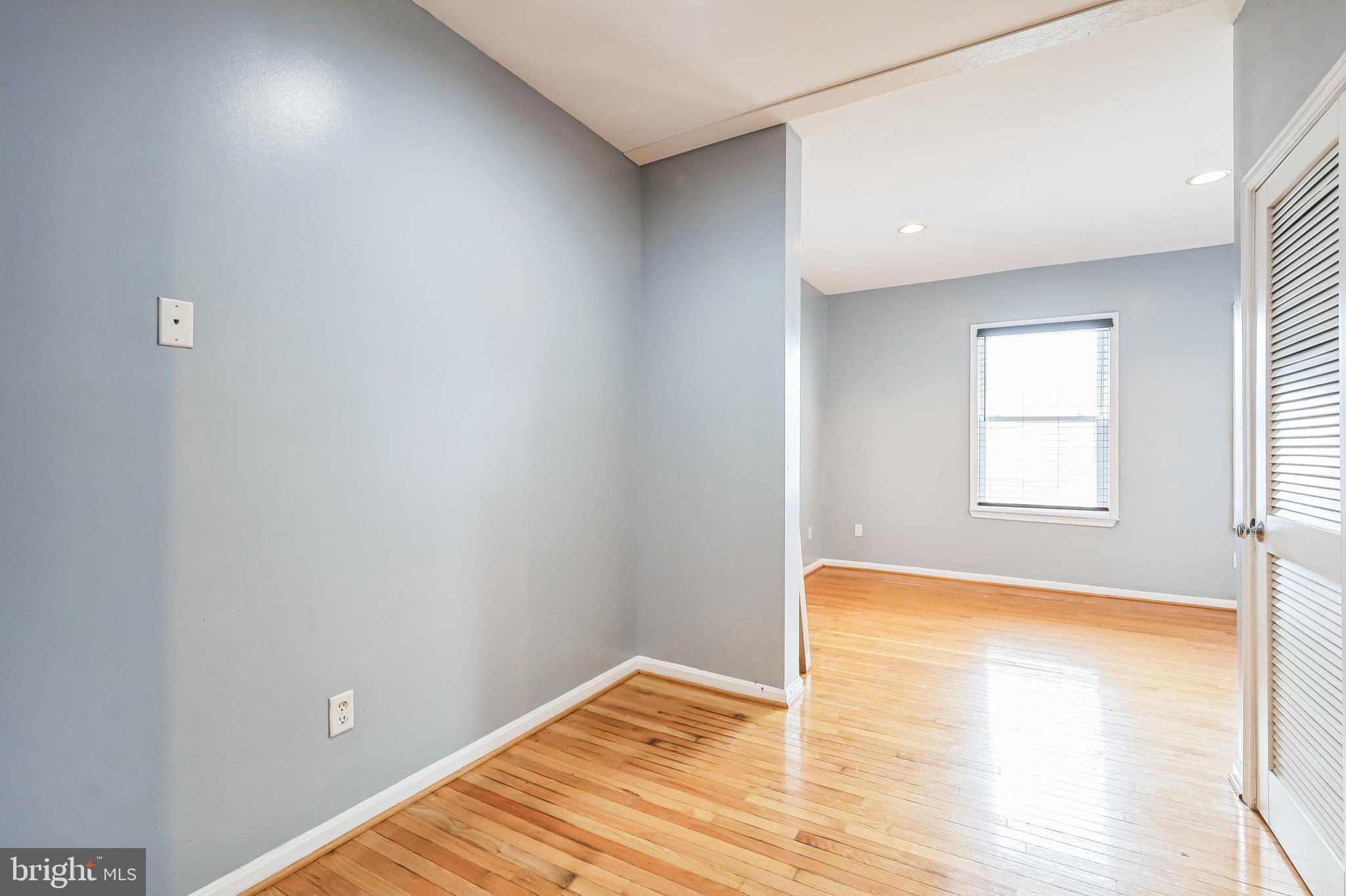 610 Irving Street Northwest, Unit 105 Washington, DC 20010 - Photo 23 of 28 a view of a room with wooden floor and a window