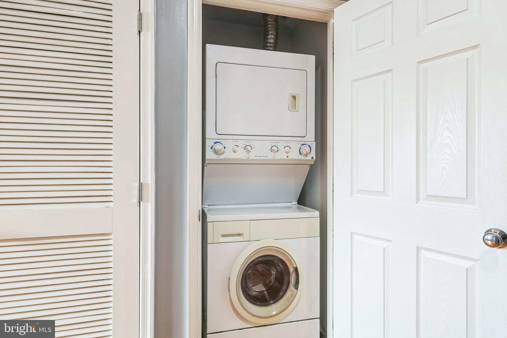 610 Irving Street Northwest, Unit 105 Washington, DC 20010 - Photo 26 of 28 a utility room with dryer and washer
