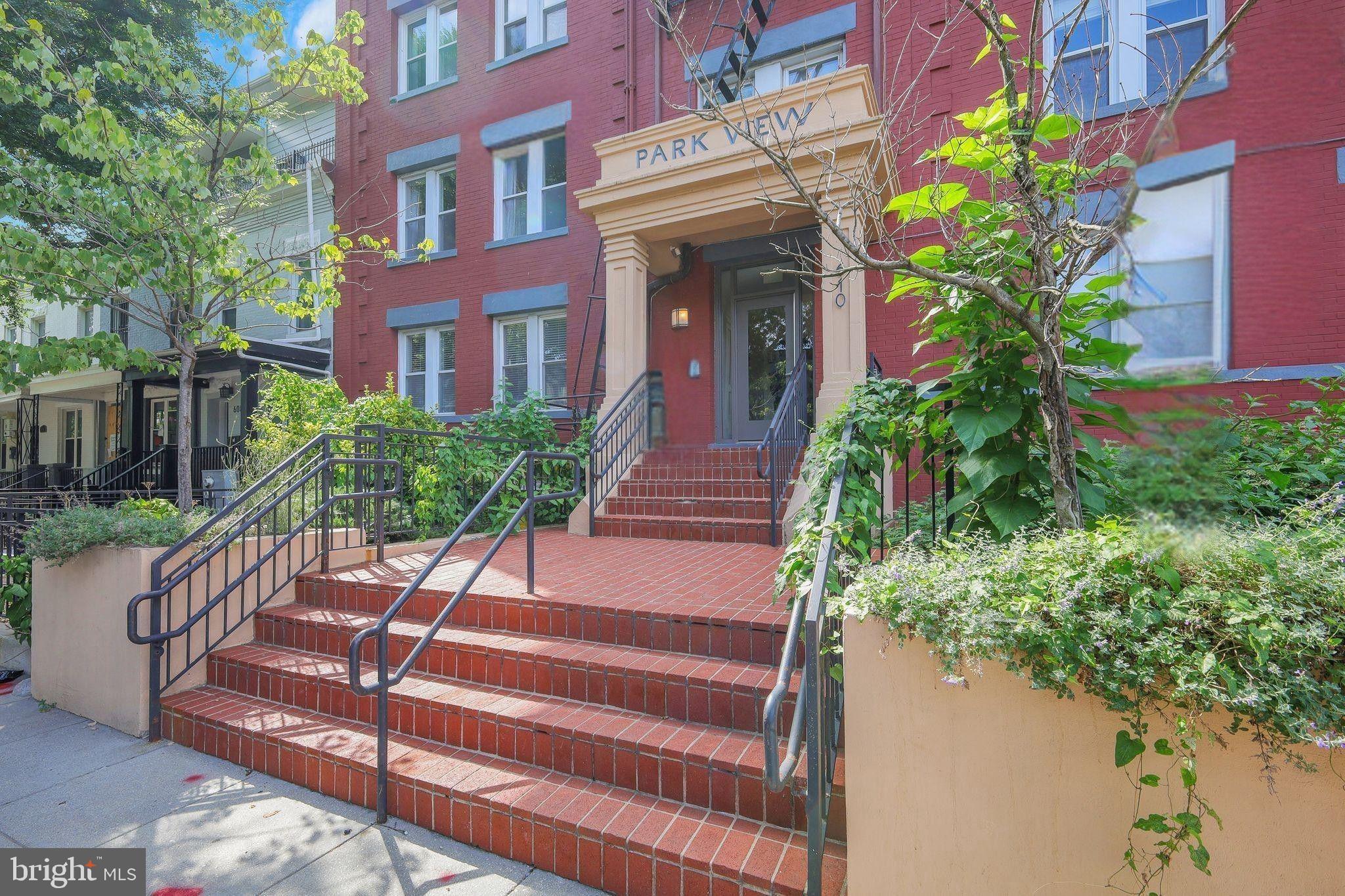 610 Irving Street Northwest, Unit 105 Washington, DC 20010 - Photo 27 of 28 a view of a house with potted plants