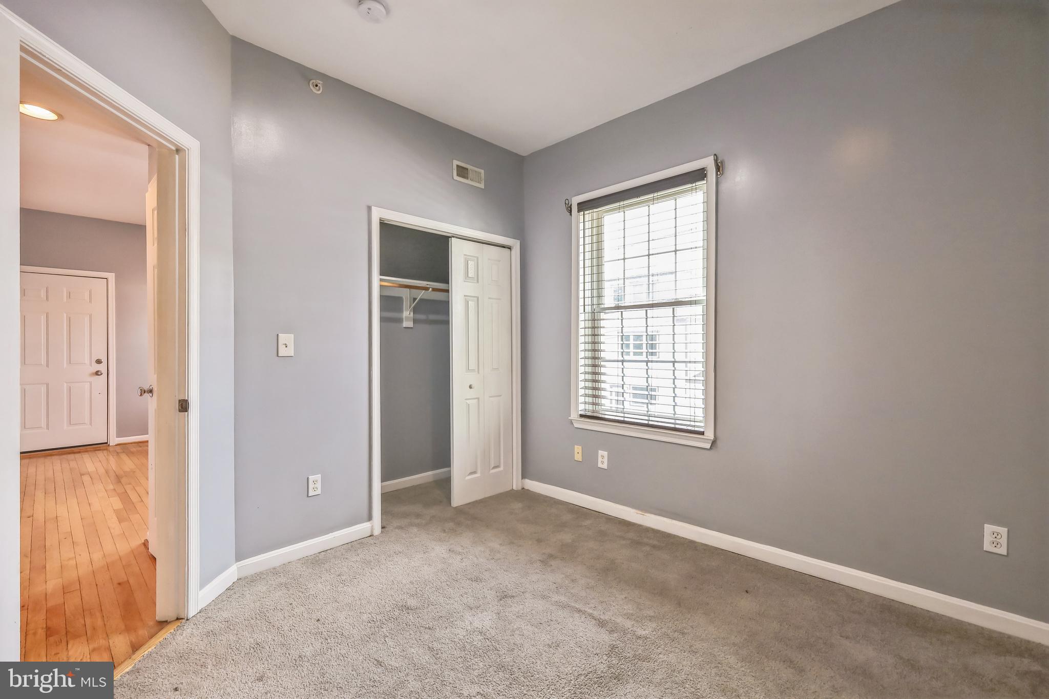 610 Irving Street Northwest, Unit 105 Washington, DC 20010 - Photo 9 of 28 a view of an empty room with window