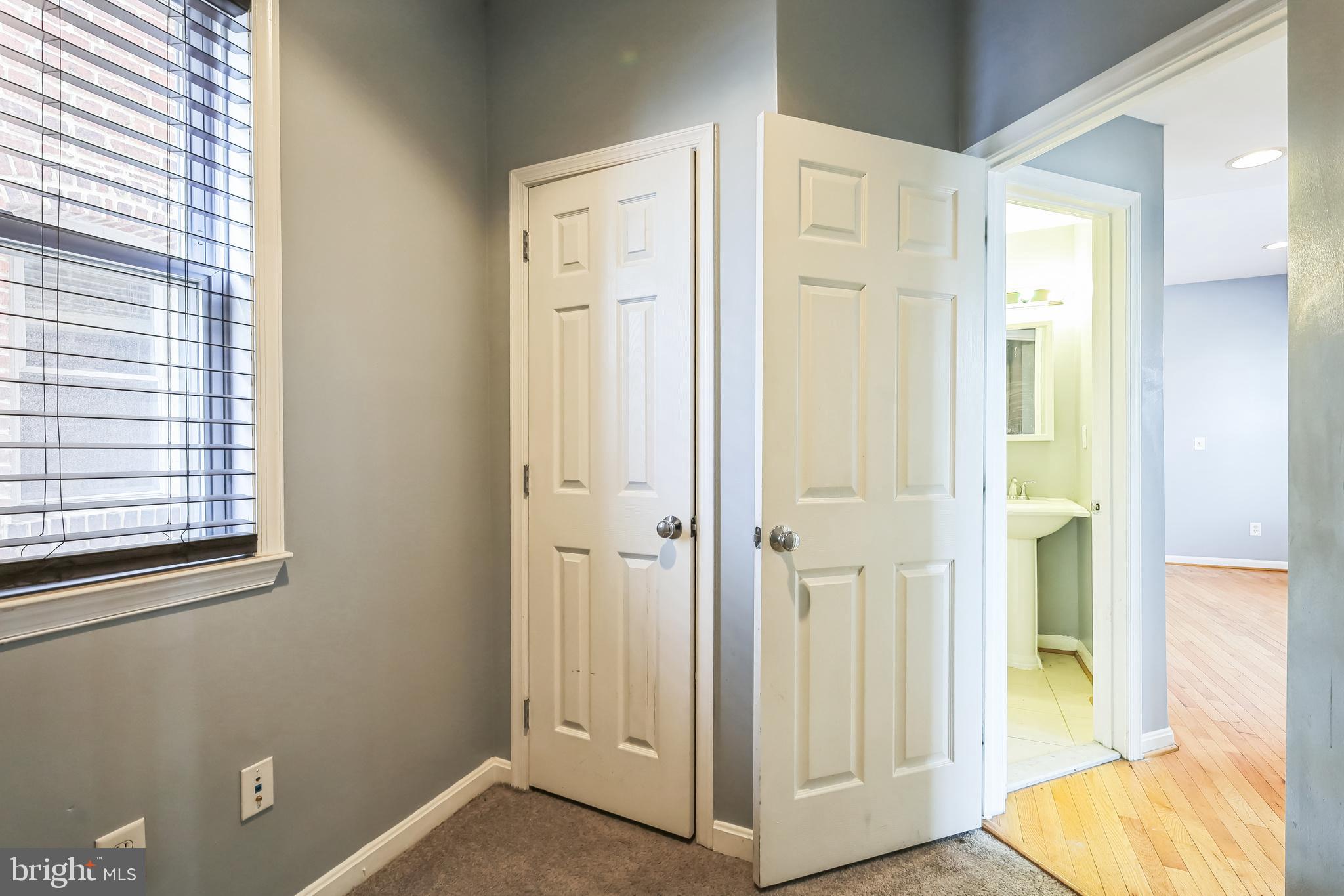610 Irving Street Northwest, Unit 105 Washington, DC 20010 - Photo 10 of 28 a view of a bathroom with front door