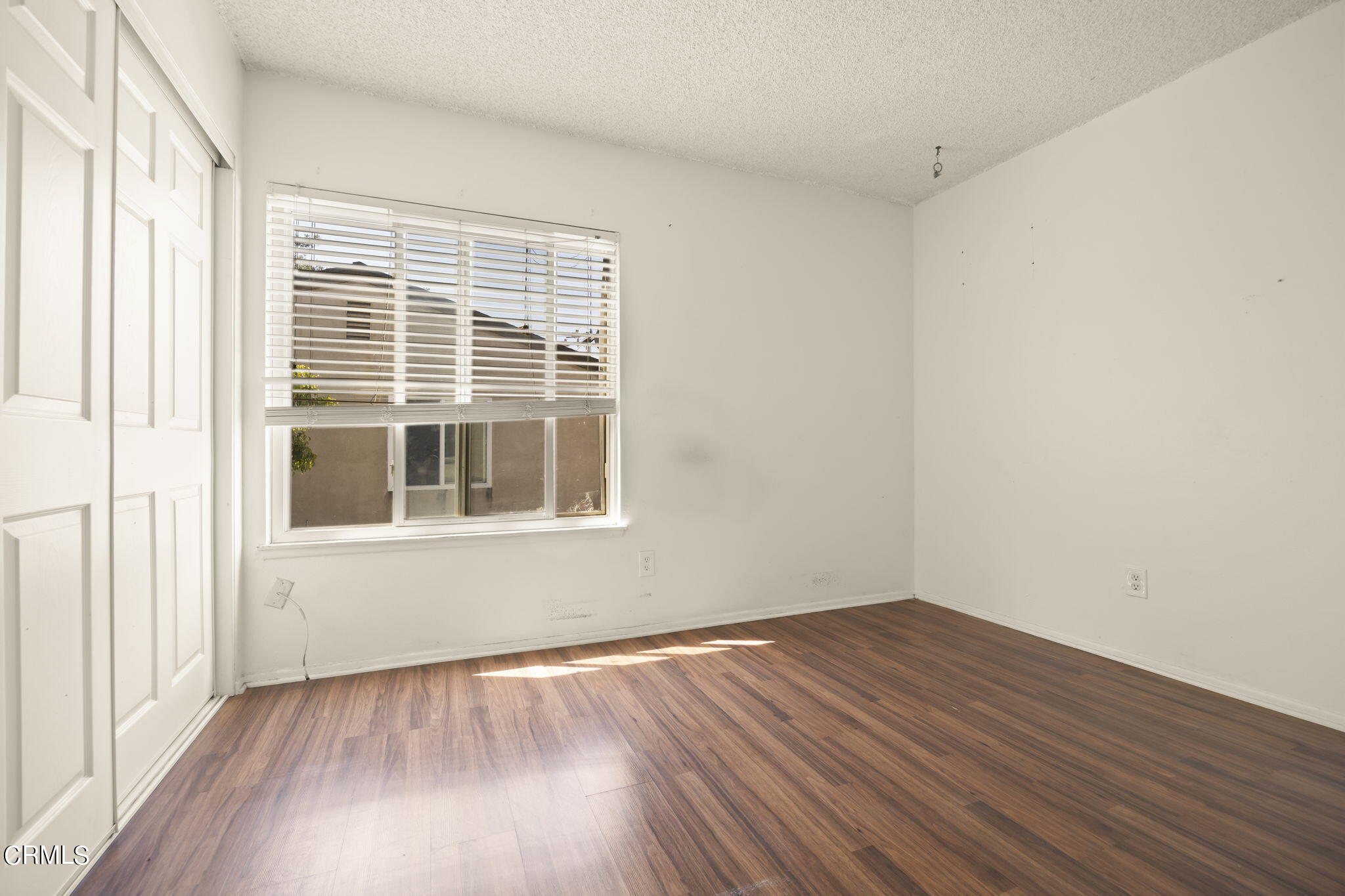 1106 Ojai Road Santa Paula, CA 93060 - Photo 19 of 45 a view of a room with wooden floor and windows