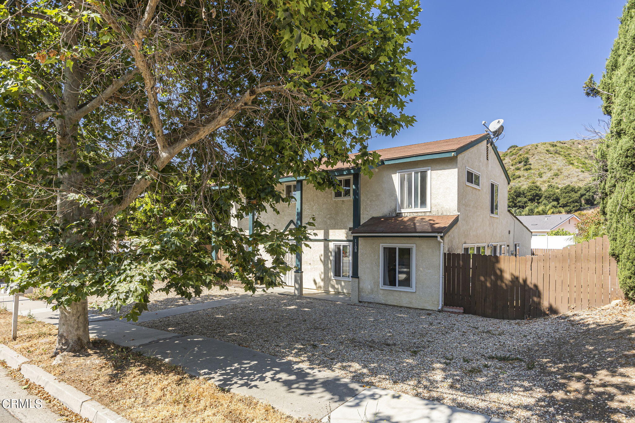 1106 Ojai Road Santa Paula, CA 93060 - Photo 2 of 45 a front view of a house with a tree
