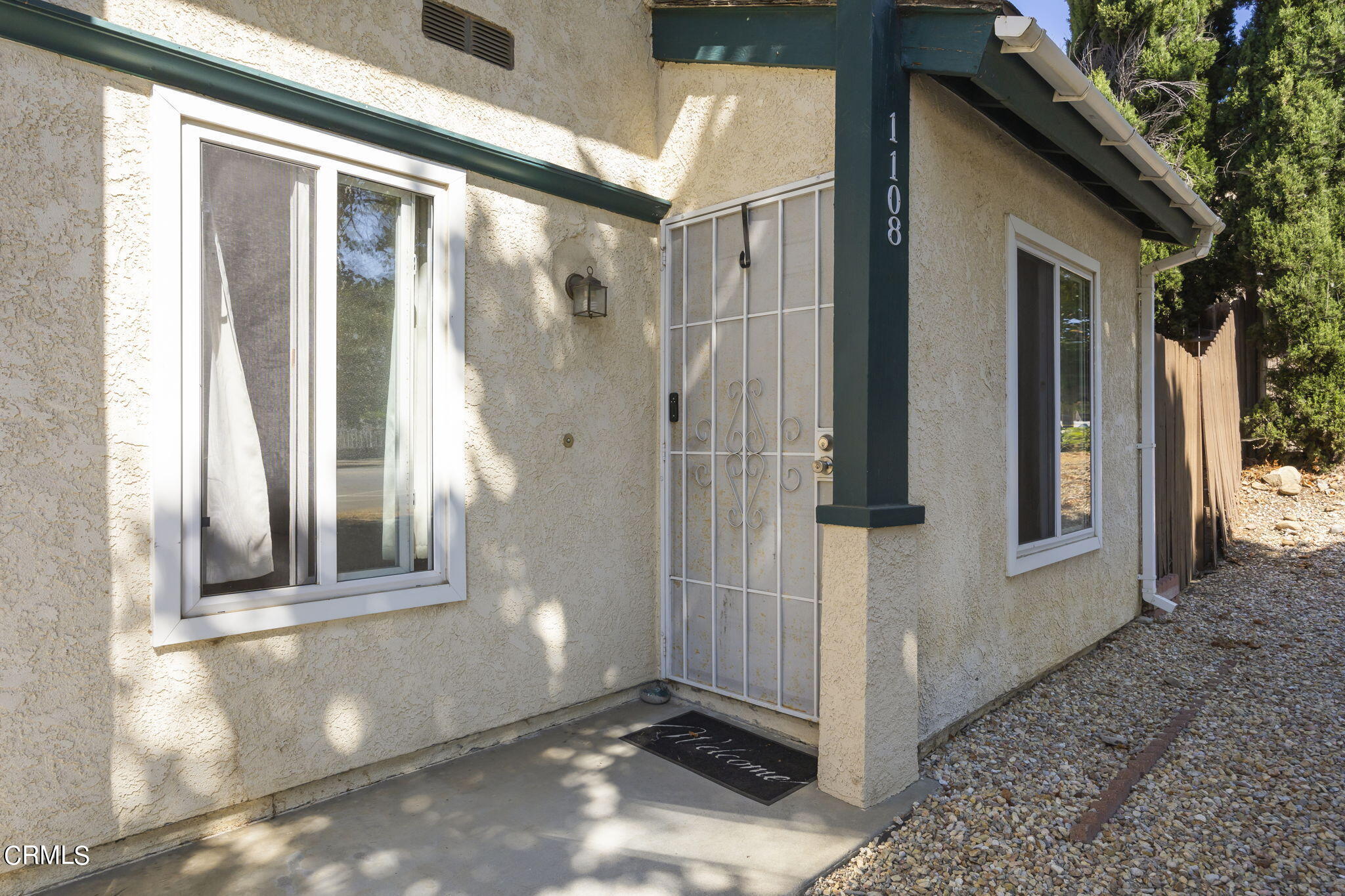 1106 Ojai Road Santa Paula, CA 93060 - Photo 24 of 45 a view of a brick house with a glass door