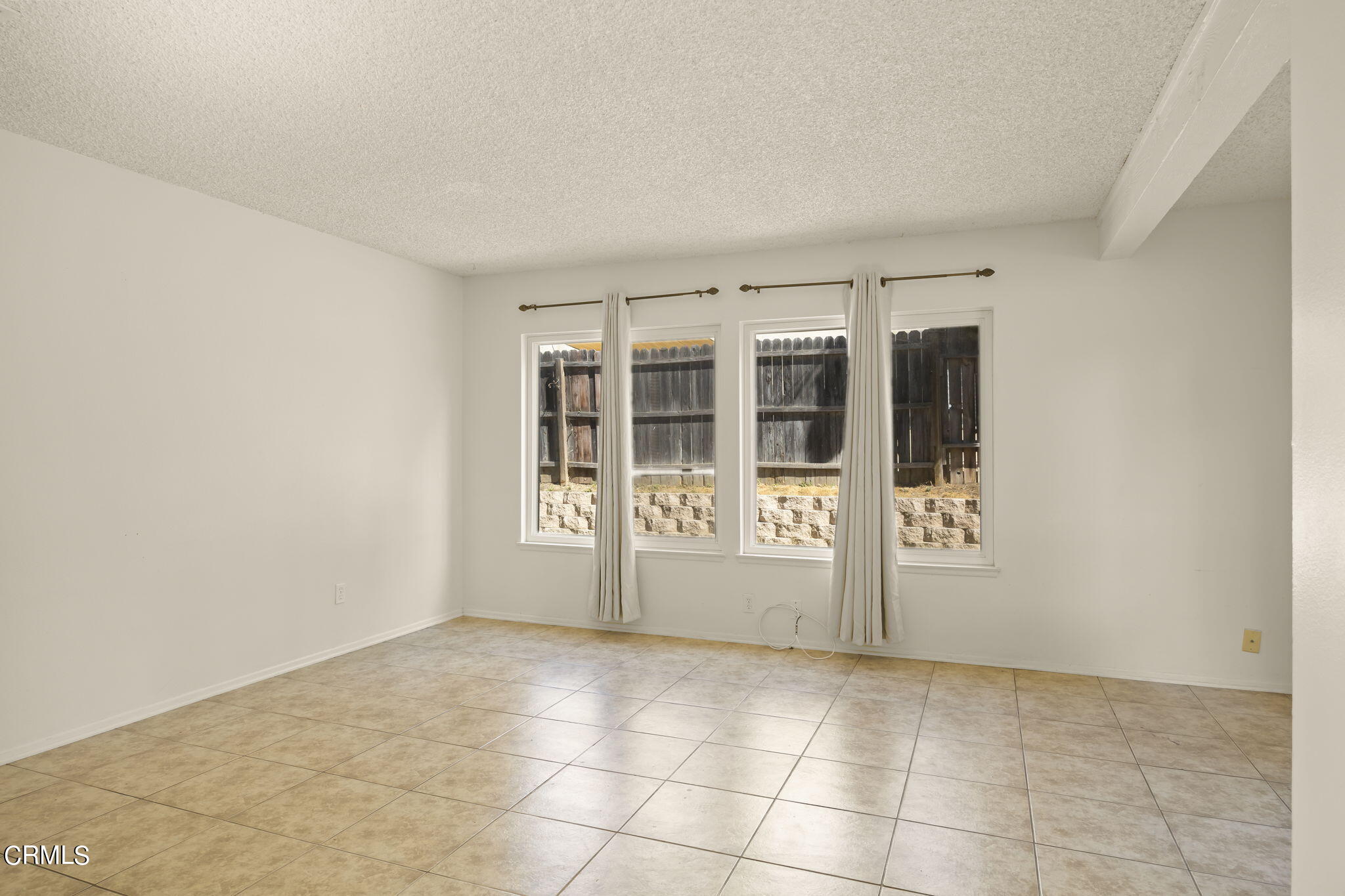 1106 Ojai Road Santa Paula, CA 93060 - Photo 27 of 45 an empty room with windows