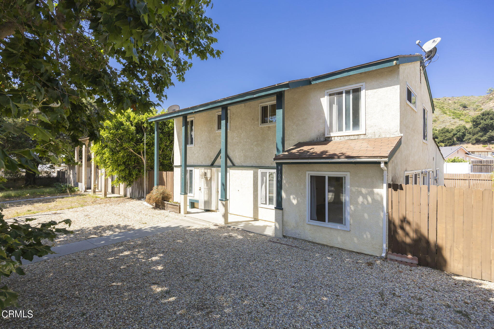 1106 Ojai Road Santa Paula, CA 93060 - Photo 3 of 45 a front view of a house with a yard