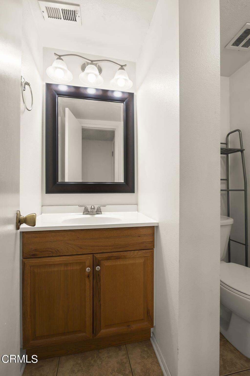 1106 Ojai Road Santa Paula, CA 93060 - Photo 32 of 45 a bathroom with a sink and a mirror