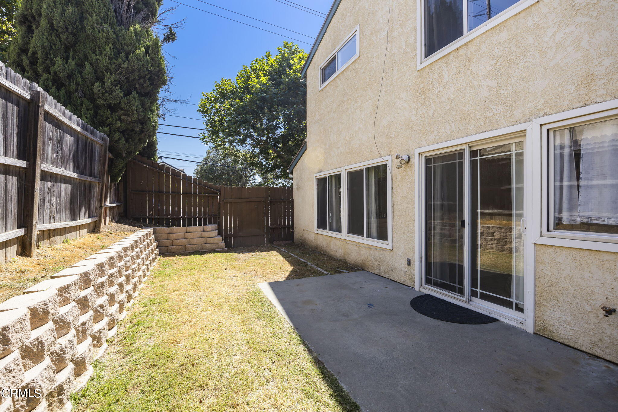1106 Ojai Road Santa Paula, CA 93060 - Photo 39 of 45 a view of backyard with large trees and wooden fence