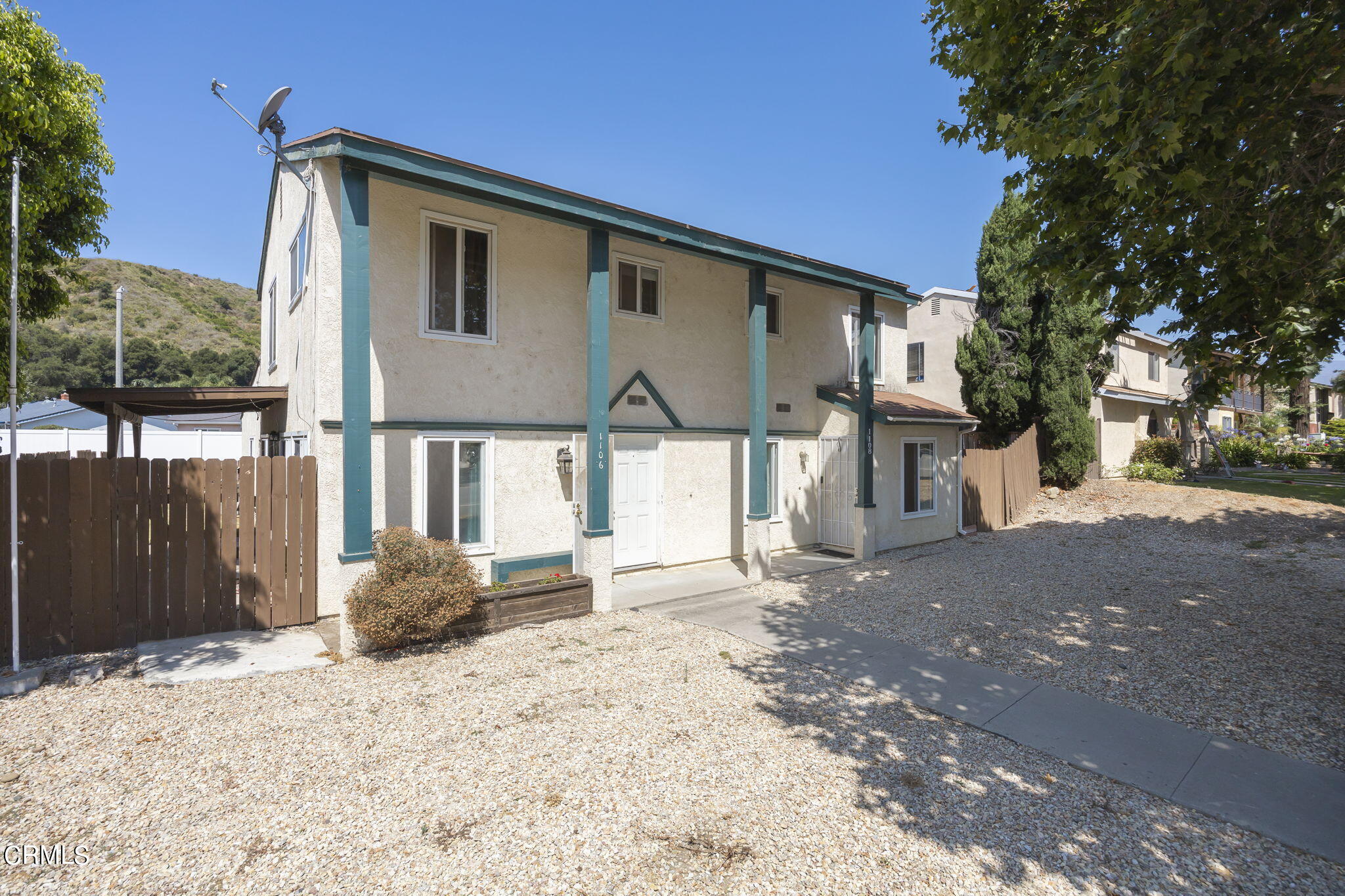 1106 Ojai Road Santa Paula, CA 93060 - Photo 5 of 45 a front view of a house with a yard