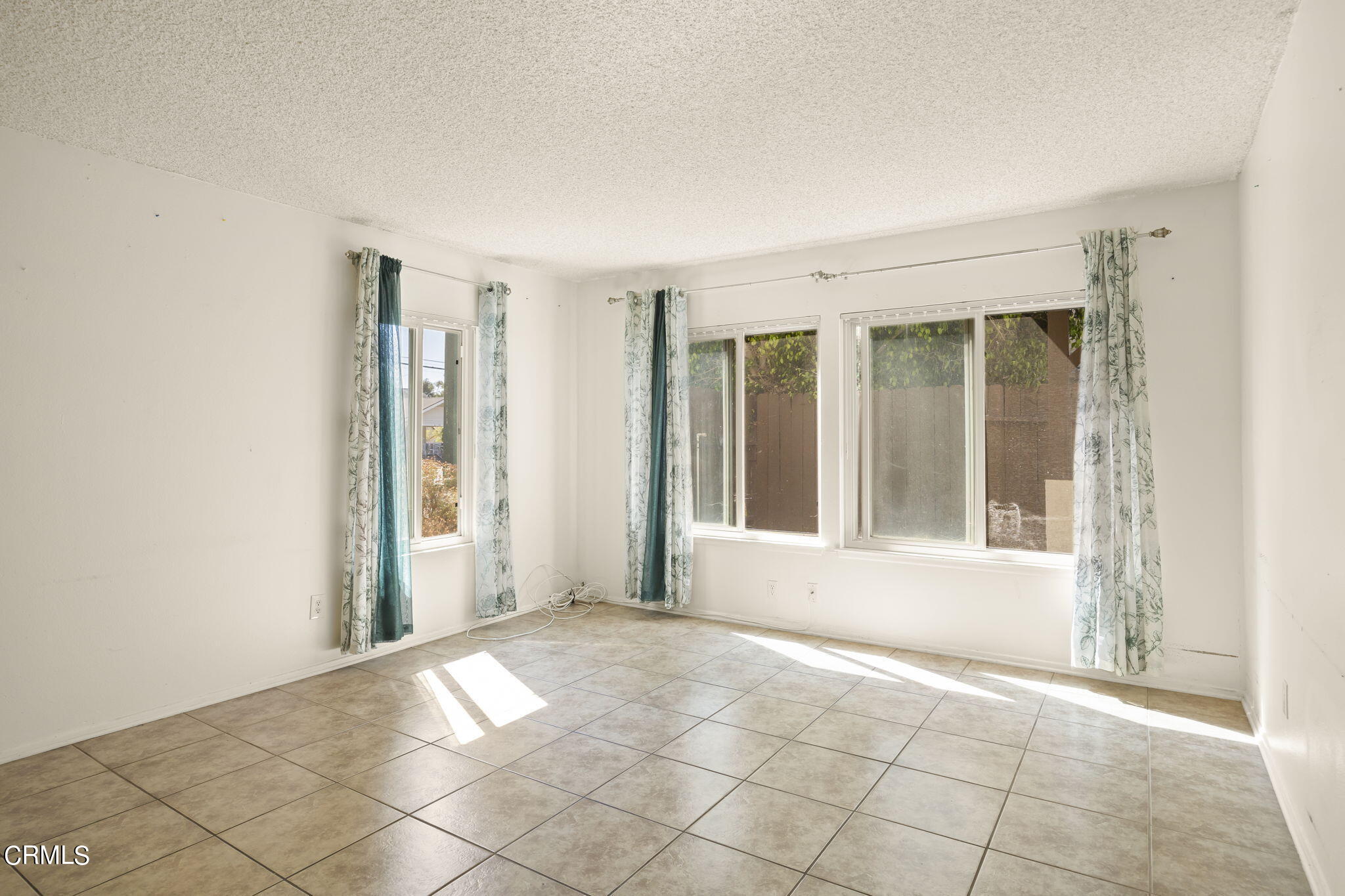 1106 Ojai Road Santa Paula, CA 93060 - Photo 8 of 45 a view of an empty room with glass door