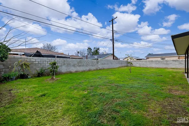 a view of a garden with a large tree