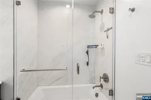 a bathroom with a sink toilet and mirror